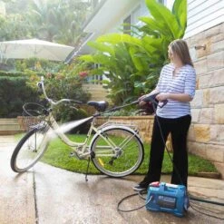 KRAPOF® Compact Electric Pressure Washer + Car Cleaning 6pc Kit + FREE E-Book - Kleva Range -Home Living Store Pressure Washer Woman in garden cleaning bike with high pressure spray gun ca7b2730 5a9e 4041 83f1 d136dc22d8e2