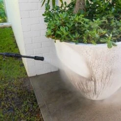 KRAPOF® Compact Electric Pressure Washer + Car Cleaning 6pc Kit + FREE E-Book - Kleva Range -Home Living Store Pressure Washer close up of high pressure spray gun cleaning dirty plant pot e5ff0587 988e 4375 90c7 26a2841034a8